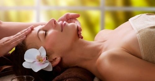 Gentle finger motions during Kobido facial massage on cheekbones and eyes