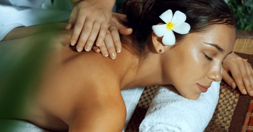 Woman receiving massage in a tranquil room